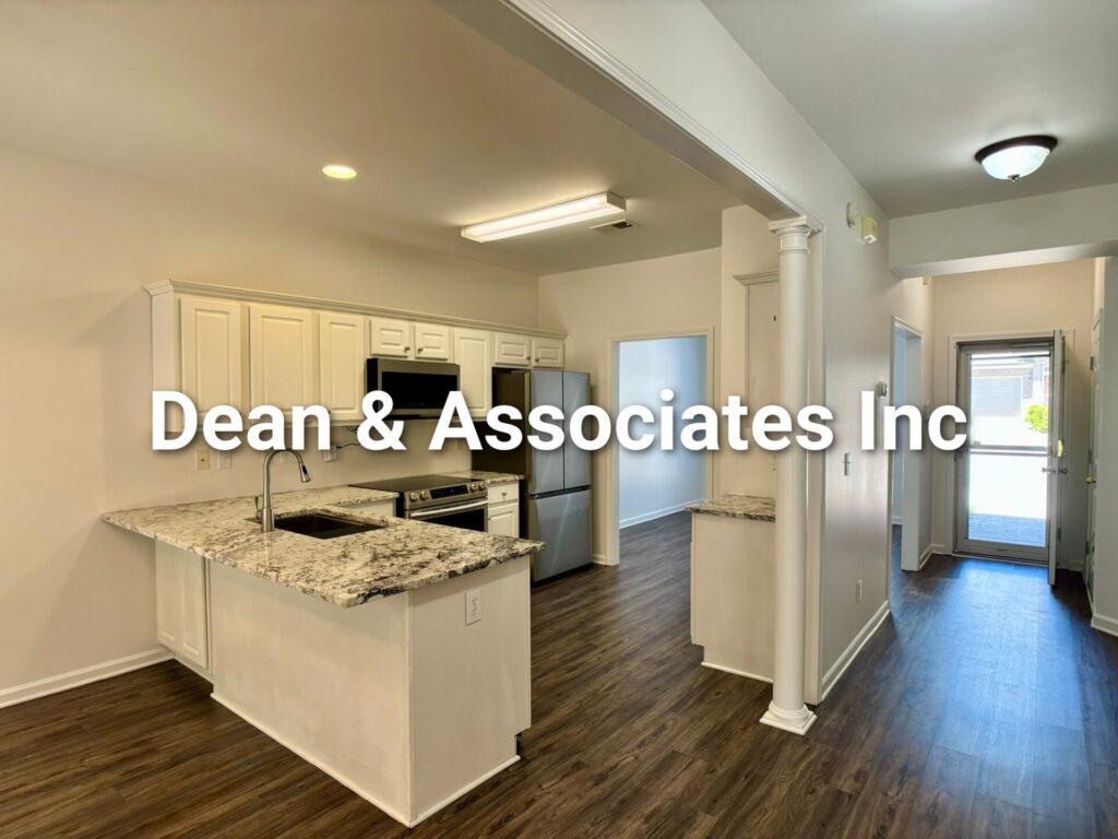 Kitchen with granite peninsula and white cabinets at 463 Reach Dr townhouse rental in Birmingham, AL