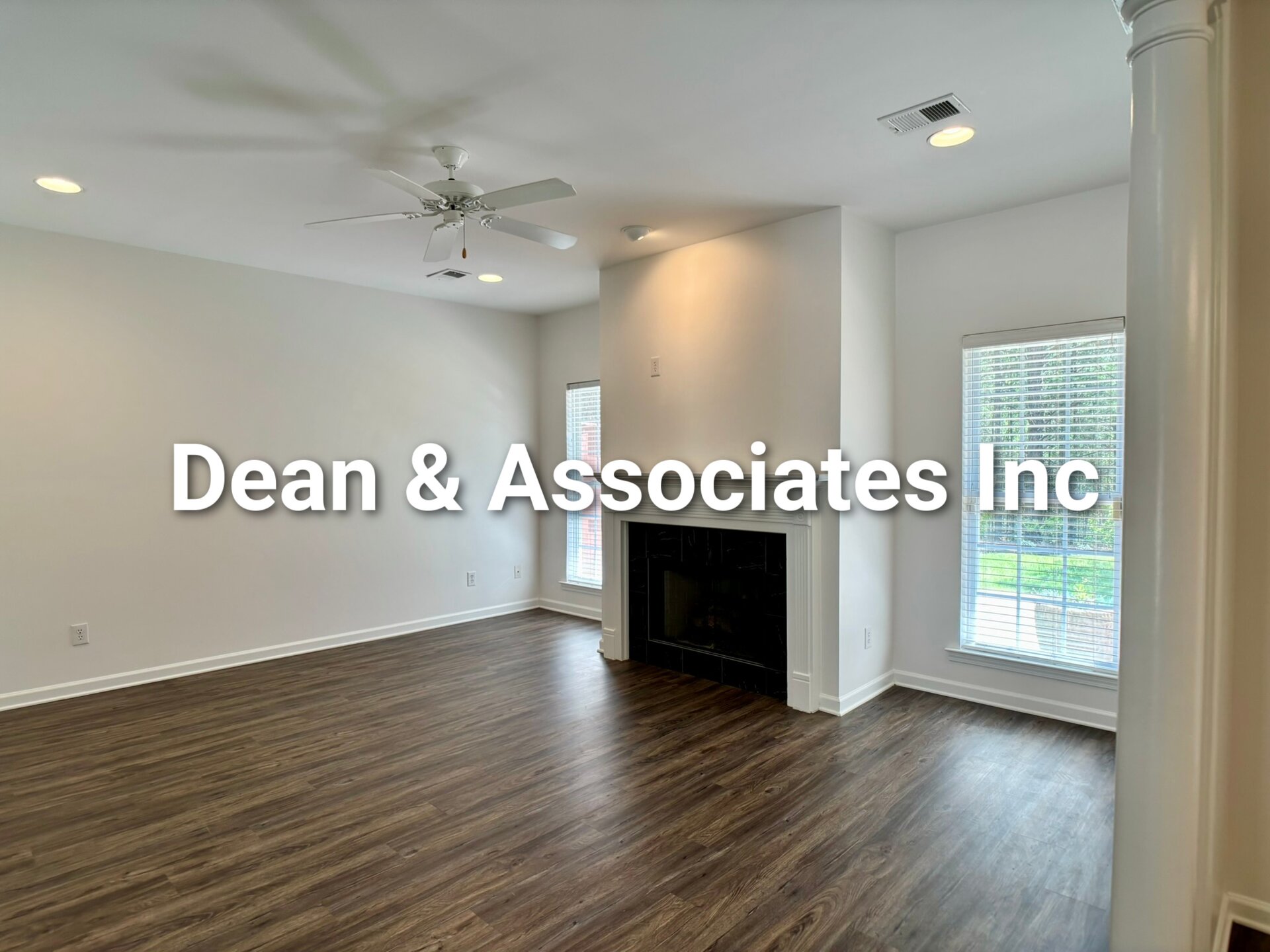 Open living room with ceiling fan and hardwood floors at 463 Reach Dr townhouse rental in Birmingham, AL