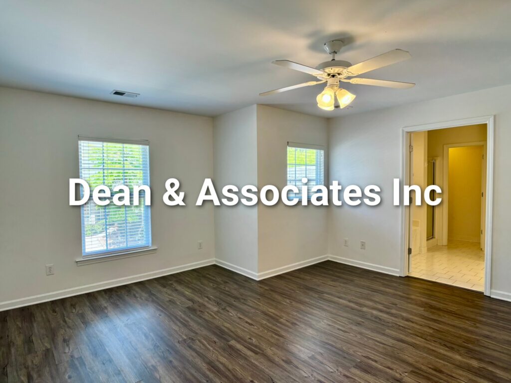 Primary bedroom with ceiling fan and ensuite bath at 463 Reach Dr townhouse rental in Birmingham, AL