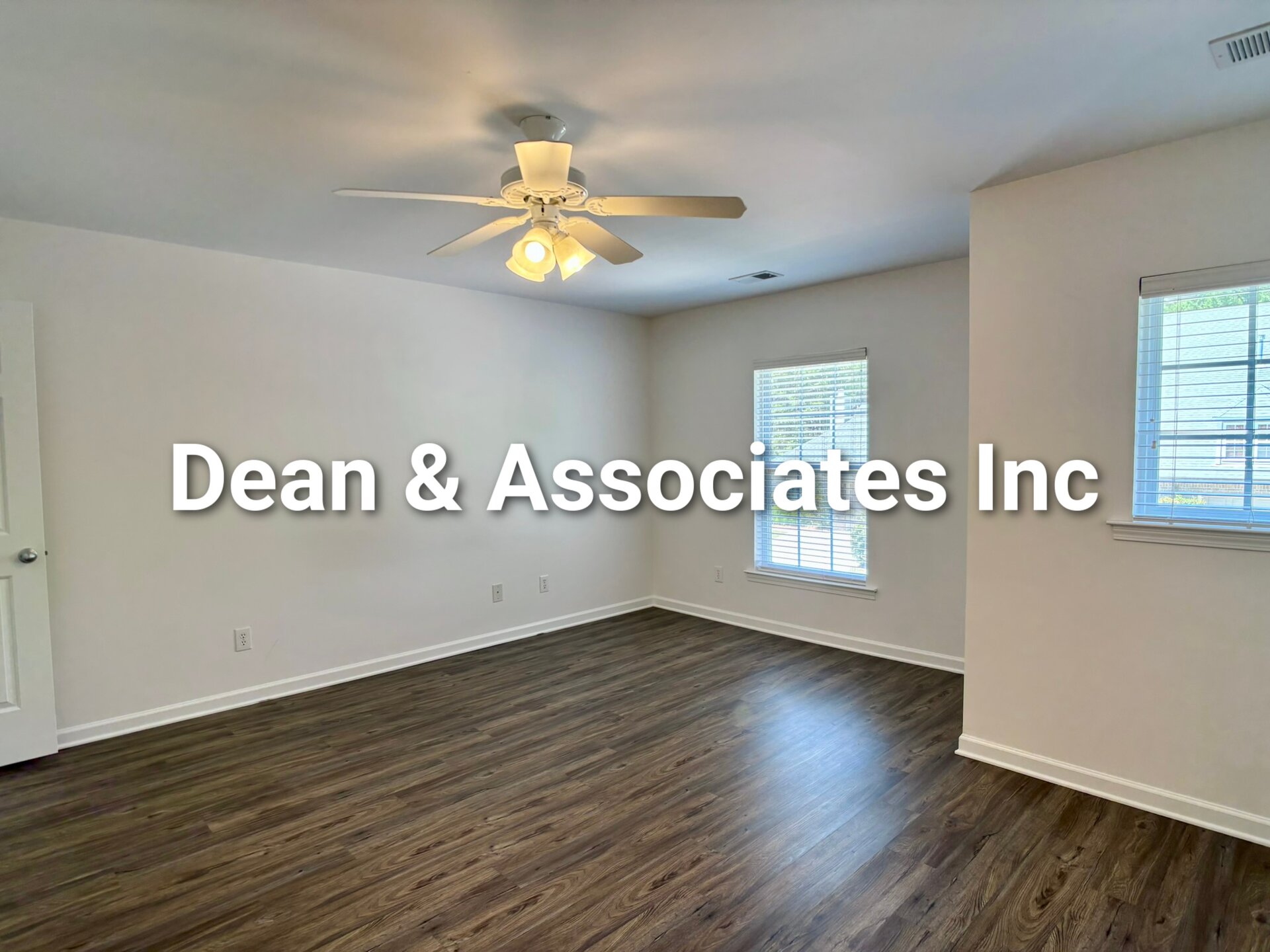 Secondary bedroom with ceiling fan and hardwood floors at 463 Reach Dr townhouse in Birmingham, AL