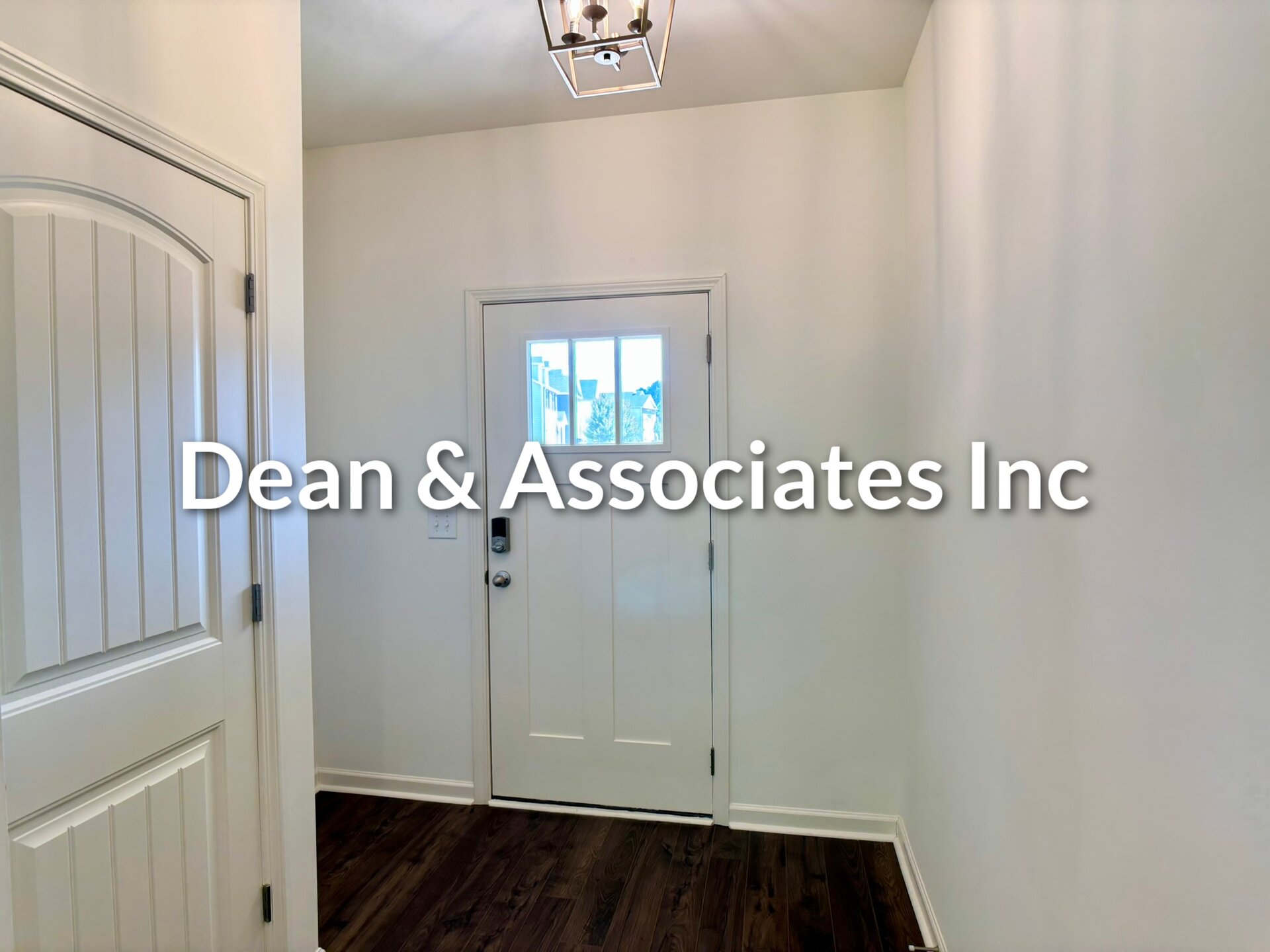 Front entry foyer with hardwood floors and front door at 464 Crossbridge Rd, Chelsea, Alabama