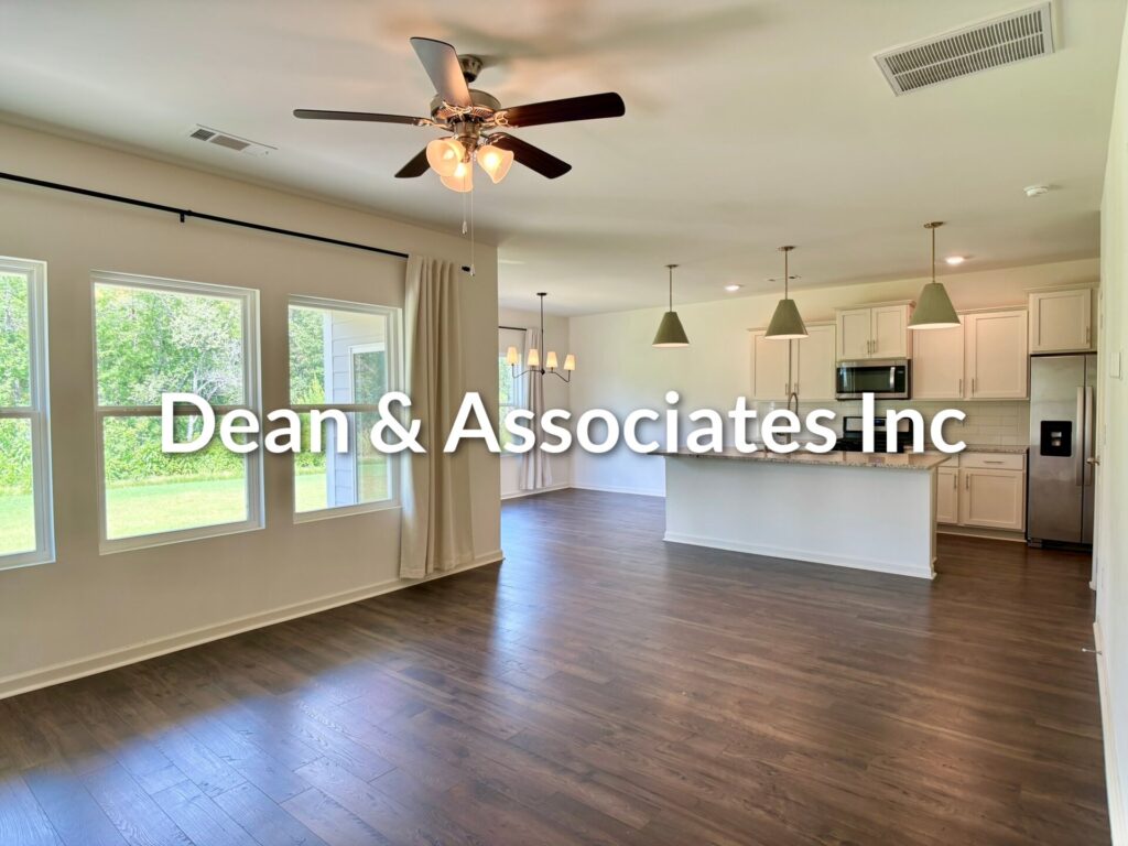 Open-concept living area with ceiling fan, hardwood floors, and view of kitchen at 464 Crossbridge Rd