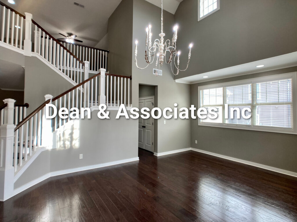Two-story foyer with hardwood floors and staircase at 472 Lake Chelsea Way, Chelsea, Alabama rental home