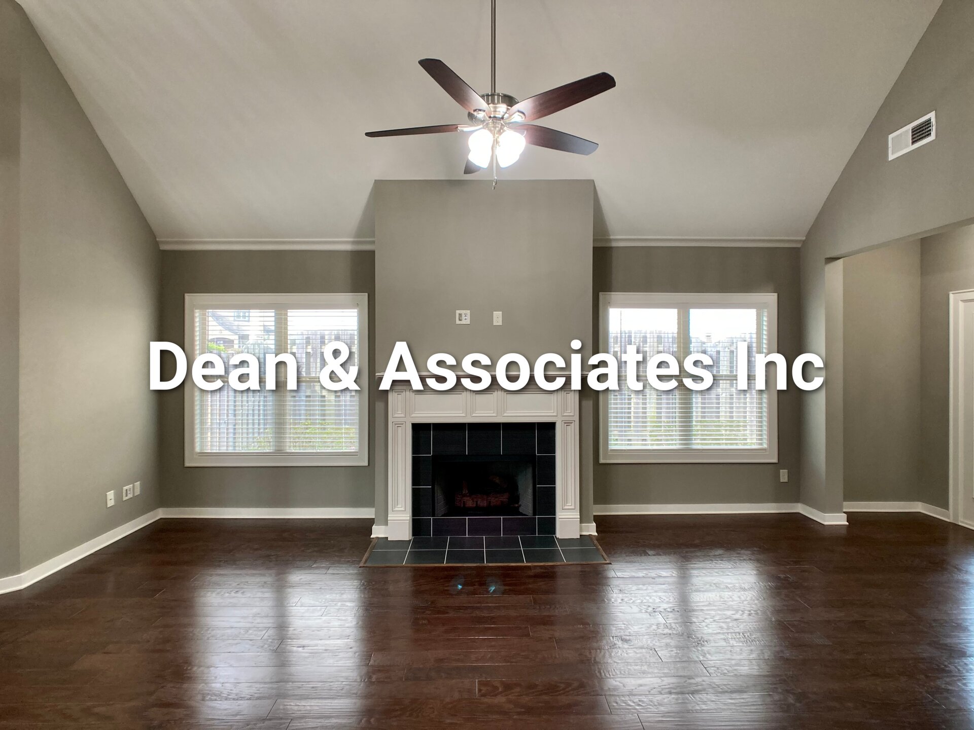 Vaulted-ceiling living room with tiled fireplace at 472 Lake Chelsea Way, Chelsea, Alabama