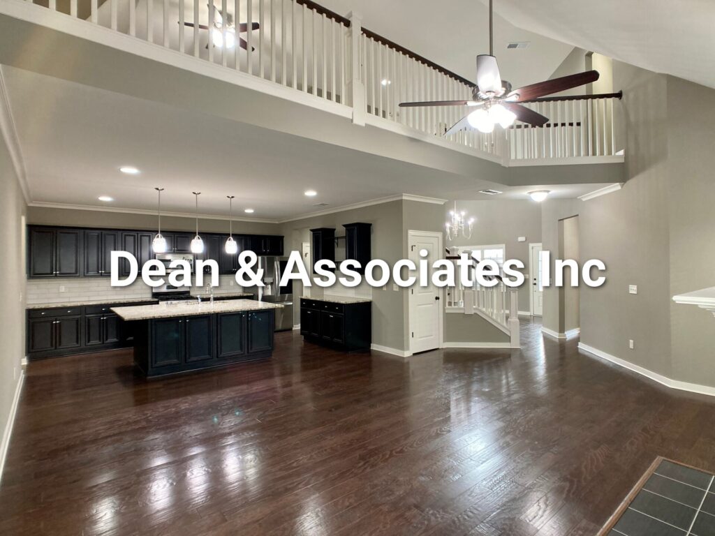 Open-concept kitchen and great room with second-floor balcony at 472 Lake Chelsea Way in Chelsea, AL