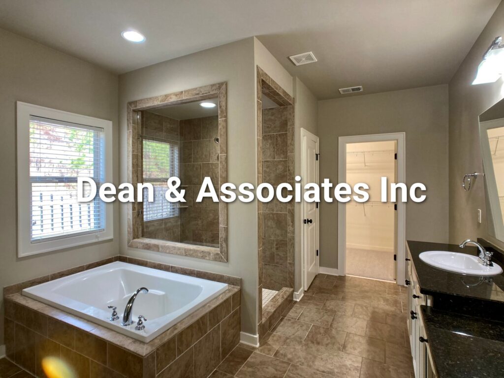 Soaking tub and walk-in closet entry in the primary bathroom of 472 Lake Chelsea Way, Chelsea, AL