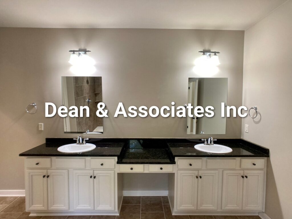 Primary bathroom double vanity with granite counters at 472 Lake Chelsea Way rental home
