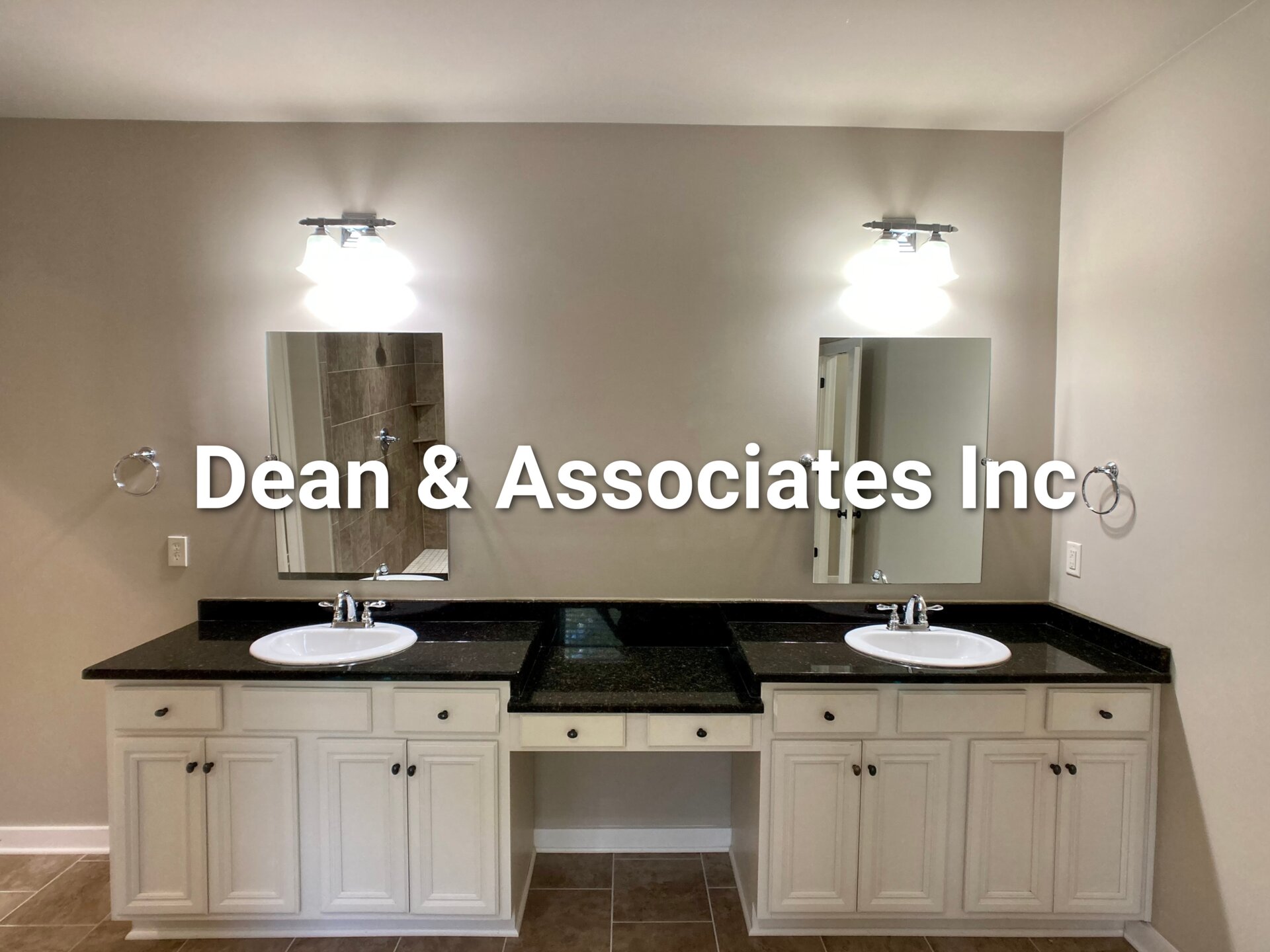 Primary bathroom double vanity with granite counters at 472 Lake Chelsea Way rental home