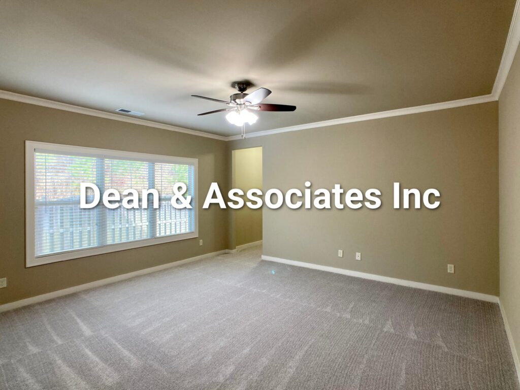 Primary bedroom with ceiling fan and large windows at 472 Lake Chelsea Way, Chelsea, Alabama