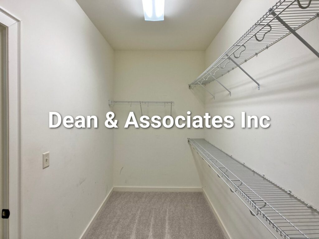 Primary walk-in closet with built-in wire shelving at 472 Lake Chelsea Way, Chelsea, Alabama