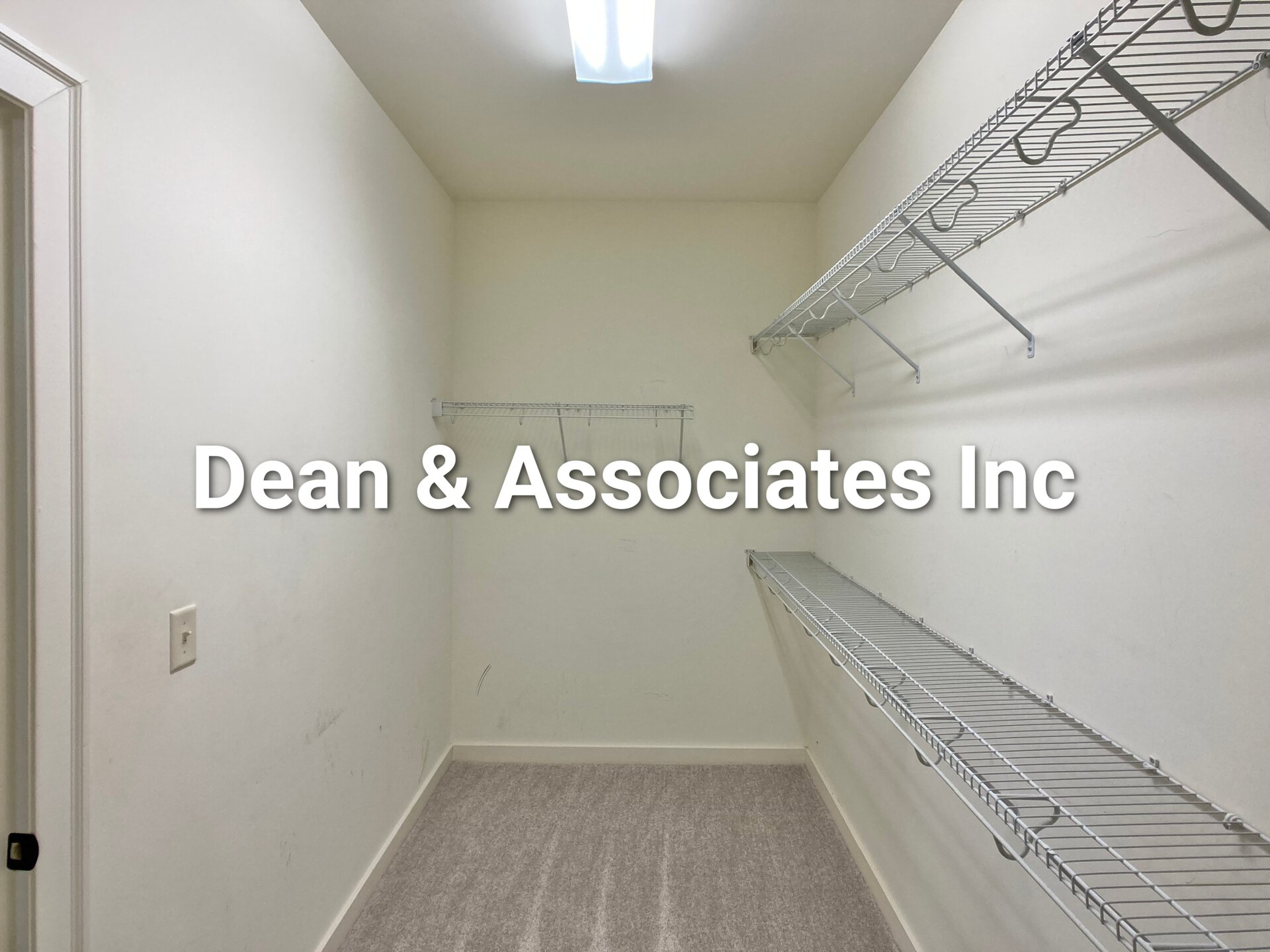 Primary walk-in closet with built-in wire shelving at 472 Lake Chelsea Way, Chelsea, Alabama